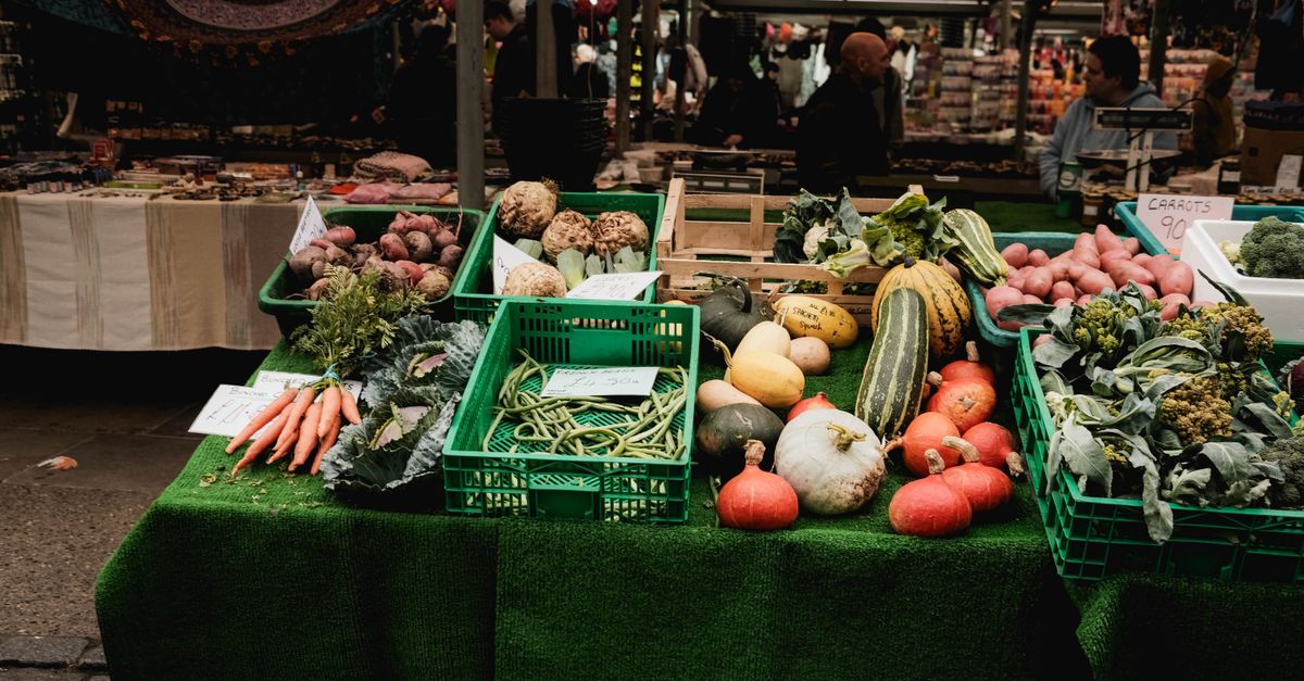 Fresh vegetables displayed at an outdoor market stall