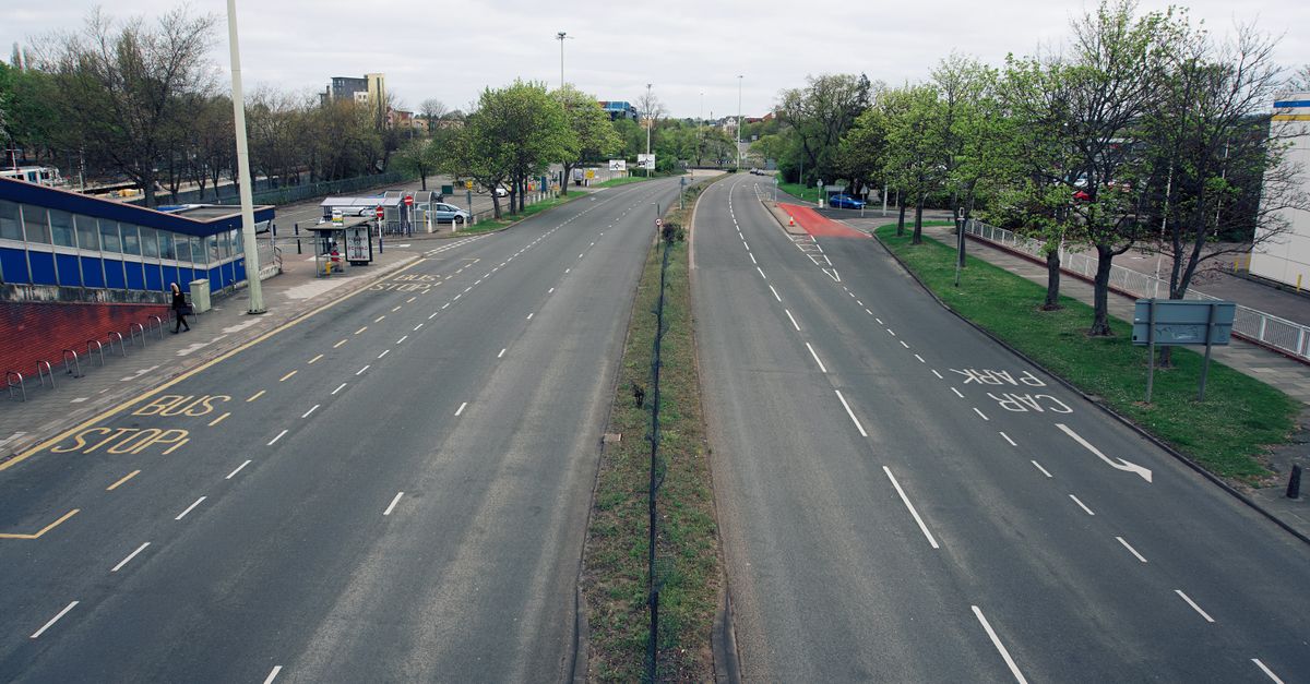A quiet suburban car park and access road
