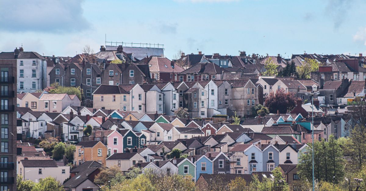 Rows of colourful terraced houses on a hillside